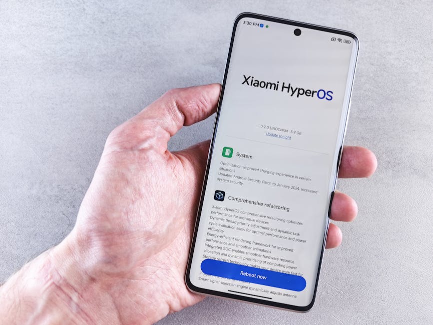 Close-up of a hand holding a Xiaomi smartphone with HyperOS interface, showcasing comprehensive refactoring and system update details.